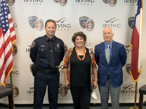 Image of Chief Spivey, Niki McCuistion and Jim Falk in front of an Irving, TX police background.
